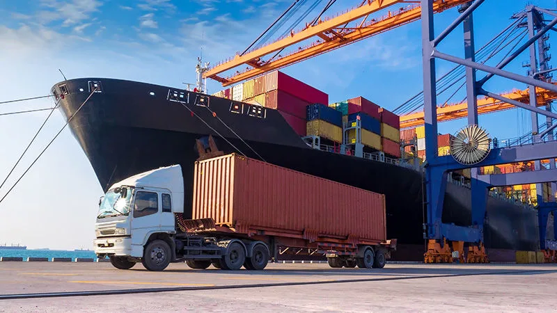 Port logistics with cargo containers and transport equipment