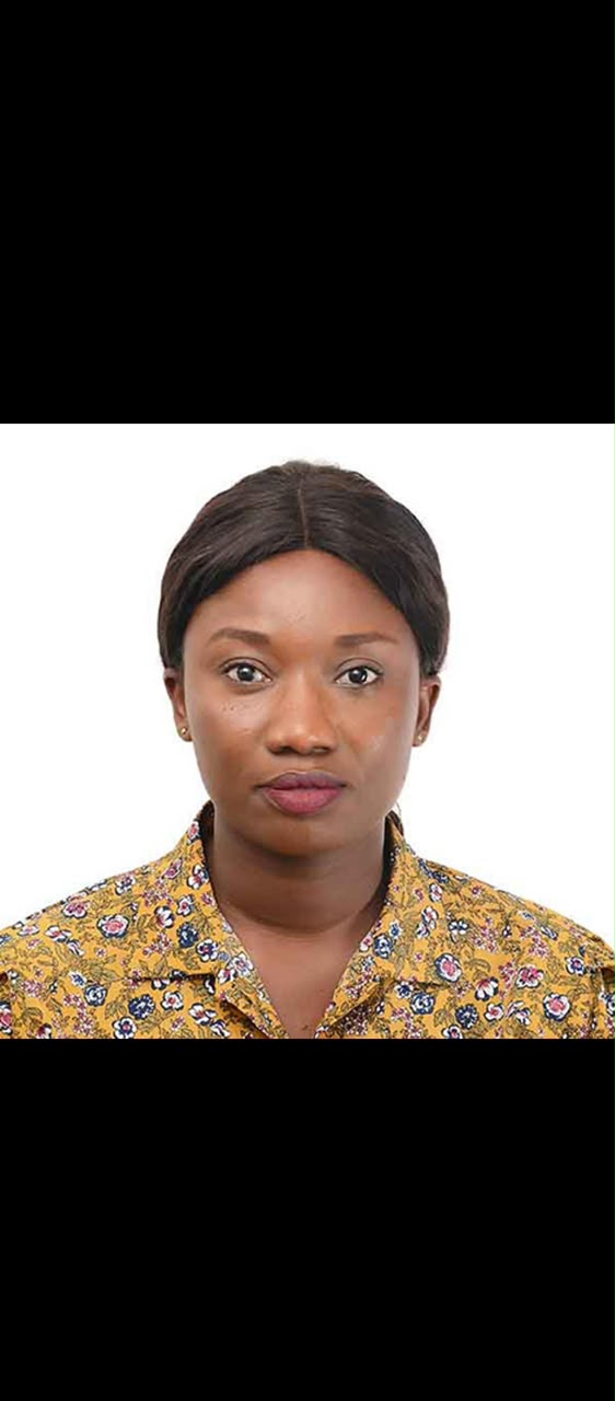 Mavis Ampiah, Procurement Manager and Secretary at Chims Eagle Eye, professional headshot in a mustard patterned blouse